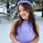 Girl wearing purple tulleen dress in the snow