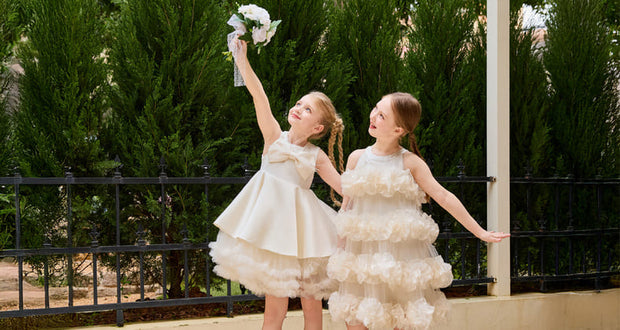Tullen-Two girls in white dresses outdoors