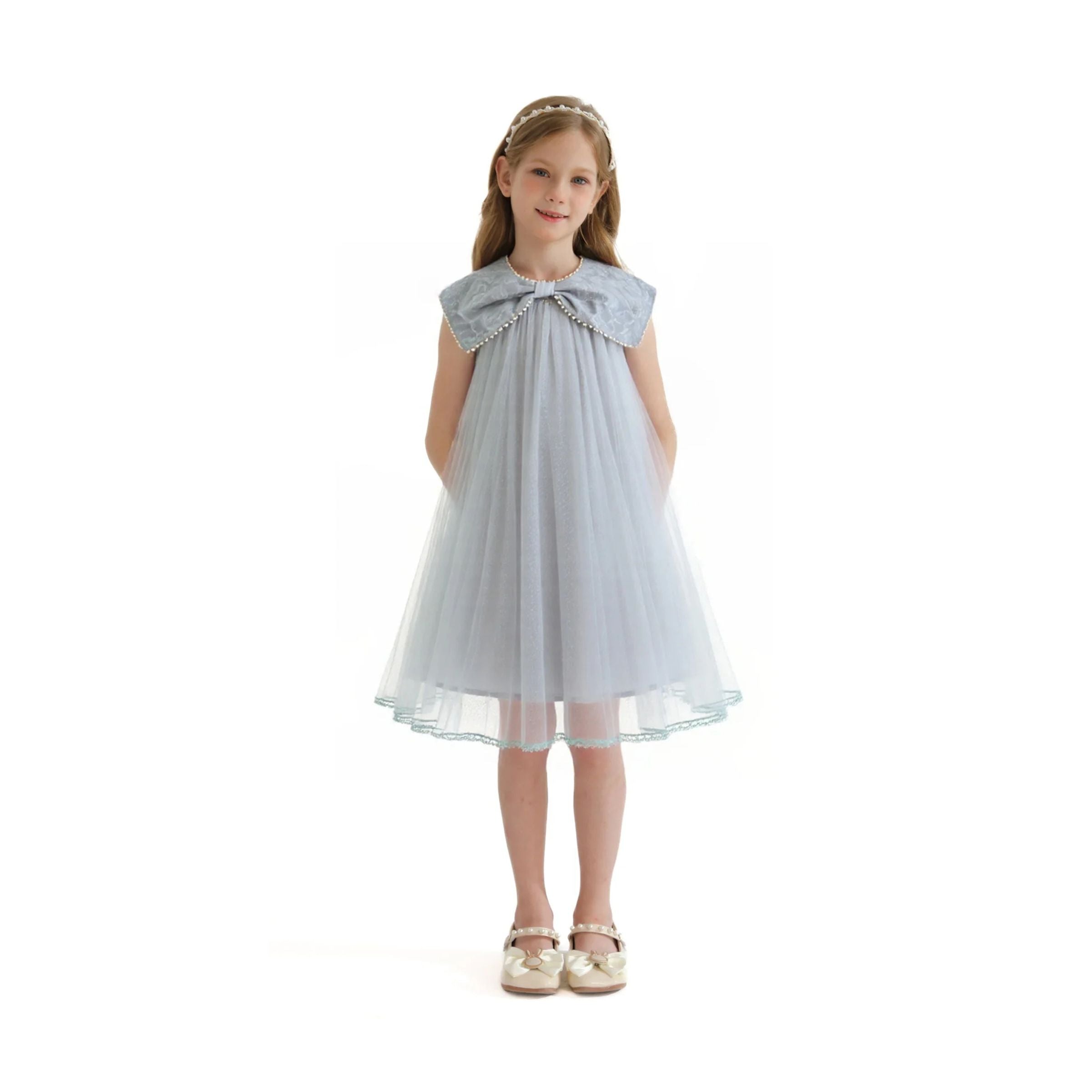 tulleen dresses Pink Violeta Sleeveless Ruffle Overlay Dress it balances timeless sophistication with playful detailing. Tulleen pearl-trim Ribbon Dress |