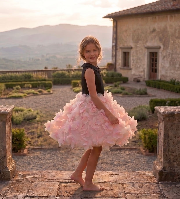 Girl in pink tutu skirt at a historic villa